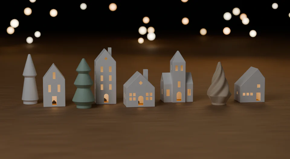 Alle acht Modelle als Weihnachtsdorf auf einem Holztisch: weiße Häuser mit warm leuchtenden Fenstern und drei Tannen, im Hintergrund unscharfe Lichter. Holztisch, Lichter und das Licht in den Fenstern sind Dekoration und nicht enthalten.